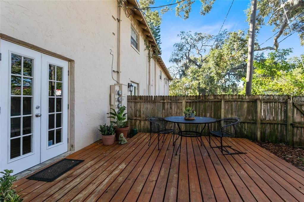 Fenced courtyard with deck