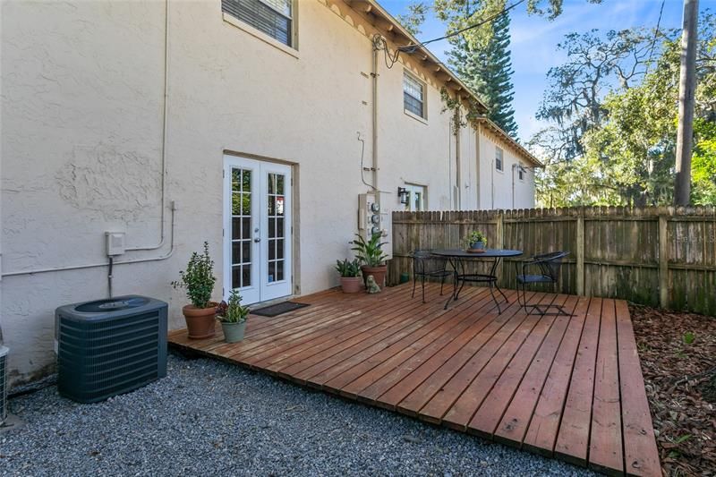 Fenced courtyard with deck