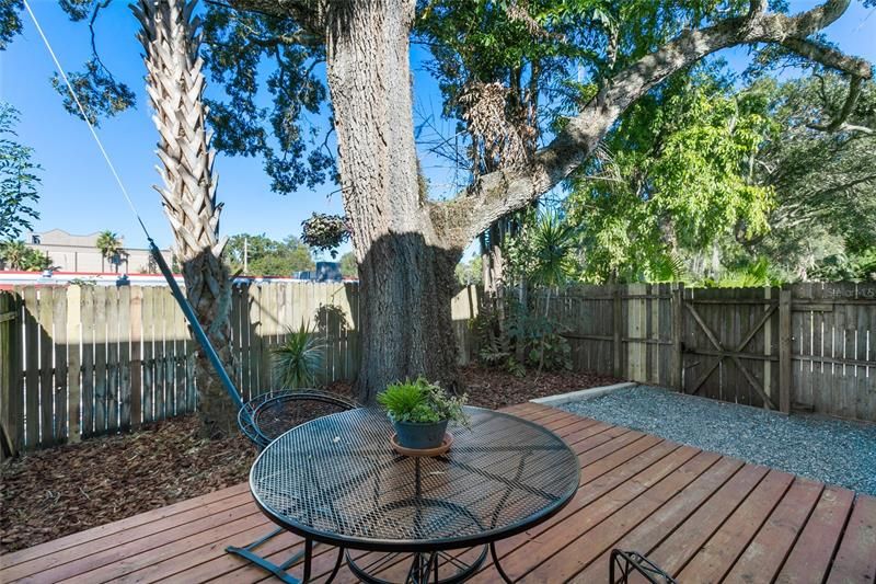 Fenced courtyard with deck