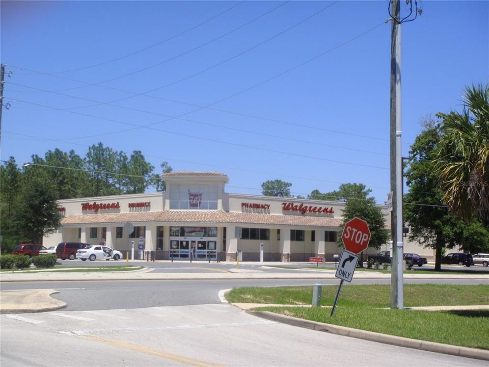 Walgreens adjoining the property with shared driveways to Maricamp Rd, Midway Rd and Midway Ter.