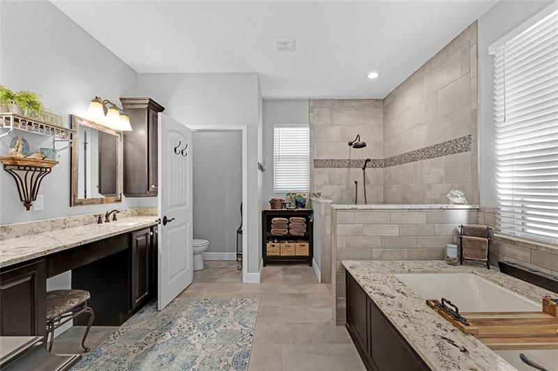 Enormous Master Bath with 2 sinks, Vanity/Makeup Counter, Oversized Soaker/Spa Tub wit Granite & Custom Tub Caddy, Walk in Shower, Separate Water Closet