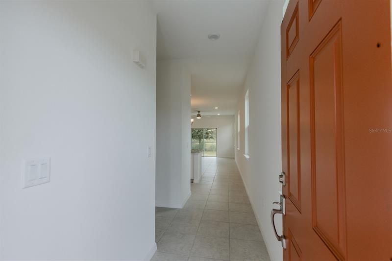 From front door into house (interior photos from model home which has same finishings as this house)