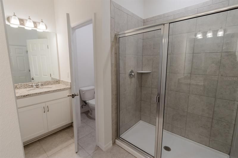 Master Bathroom with Water Closet and Shower (interior photos from model home which has same finishings as this house)