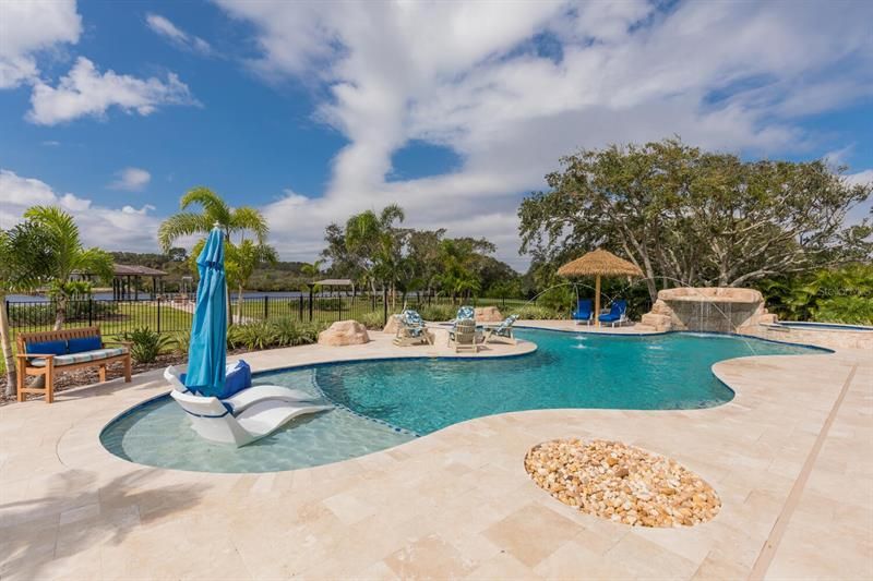 70' saltwater pool, 6 seat hot tub, waterfall, fountains, fire pit and gas tiki torches