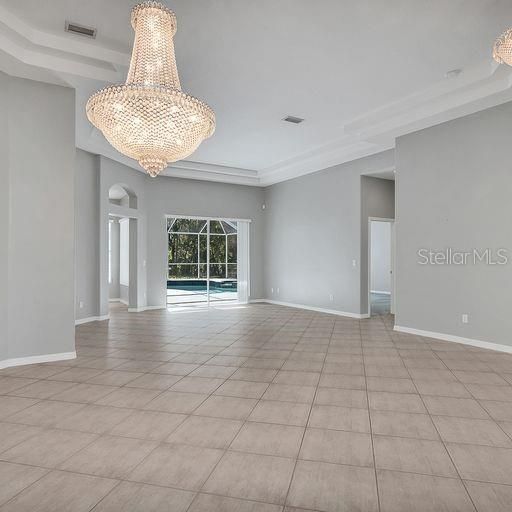 ;IVING/DINING AREA FACING POOL & ENTRANCE TO MASTER SUITE