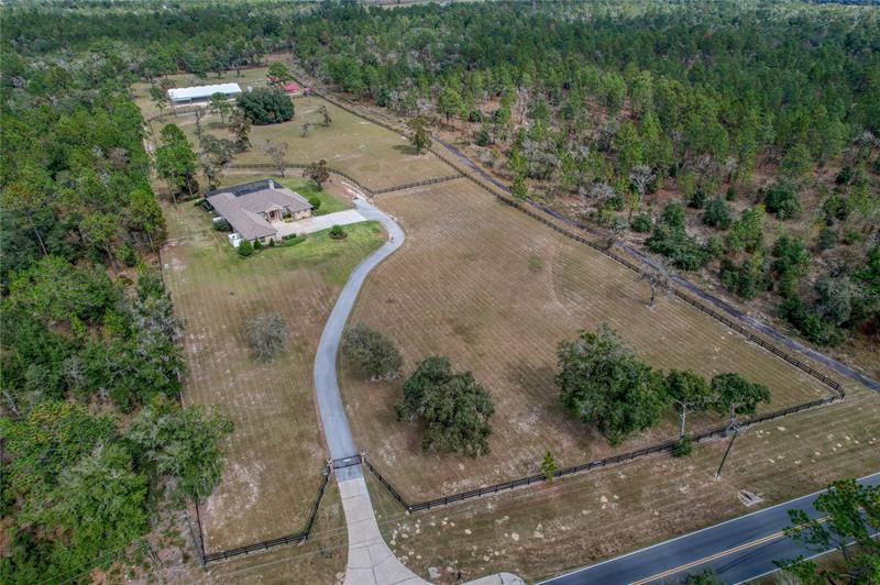 Property surrounded by trees on 3 sides