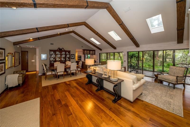 Beamed ceiling and Caribbean Walnut floors, natural light provided by 3 skylights and rows of windows