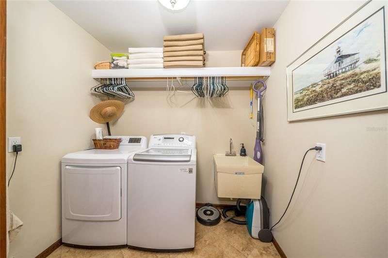 Laundry Room with utility sink and shelves