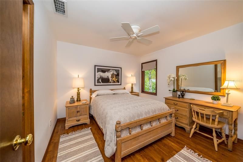 3rd bedroom with luxury vinyl plank floor and ceiling fan (2020) Marvin casement window (2014)