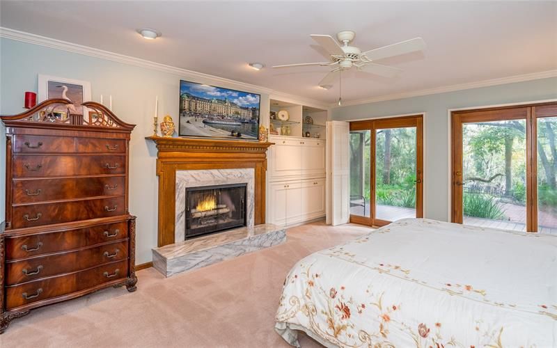 Master bedroom with wood burning fireplace, oak mantle and Carerra marble surround/hearth