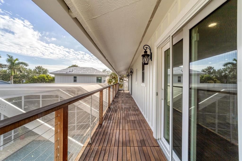 THIRD LEVEL BALCONY FROM SECOND OWNER'S SUITE AND TWO GUEST BEDROOMS WITH WATERVIEWS