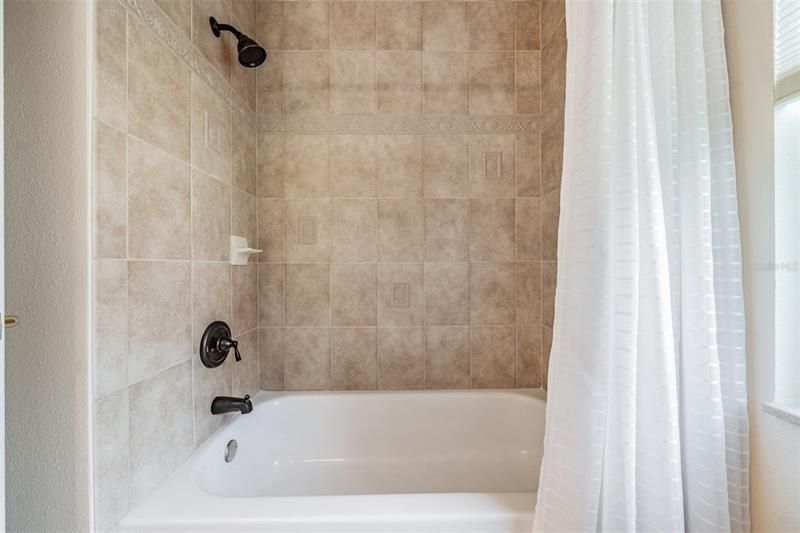 Full bathroom 2 - tiled tub/shower combo