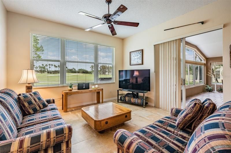Separate family room adjoins lanai and views golf course