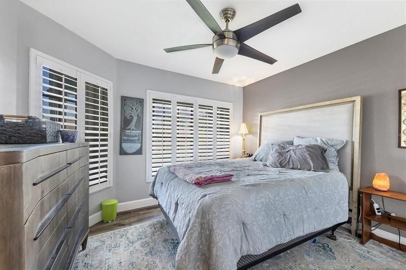 Guest room with beautiful garden views and plantation shutters.