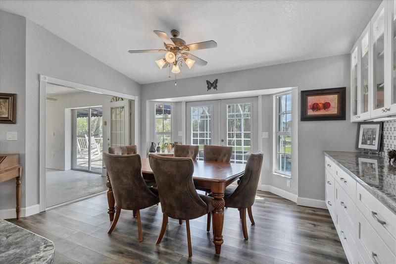 Serene eating area off the kitchen note the custom cabinets.