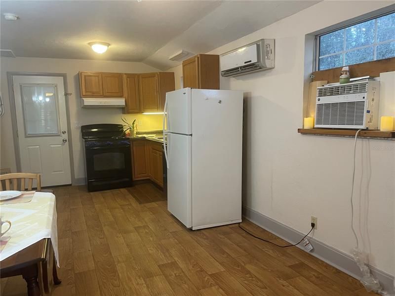 looking from living room to dinning and kitchen