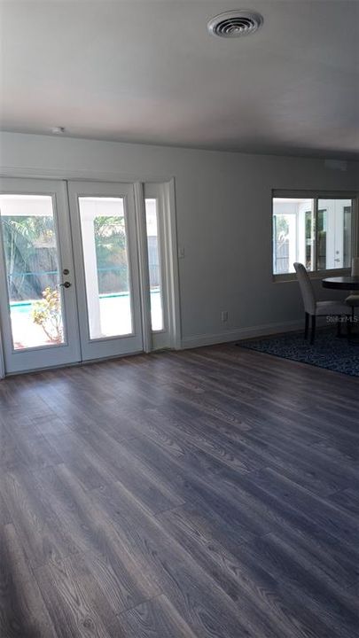 View of Living Room toward French Doors leading to Lanai