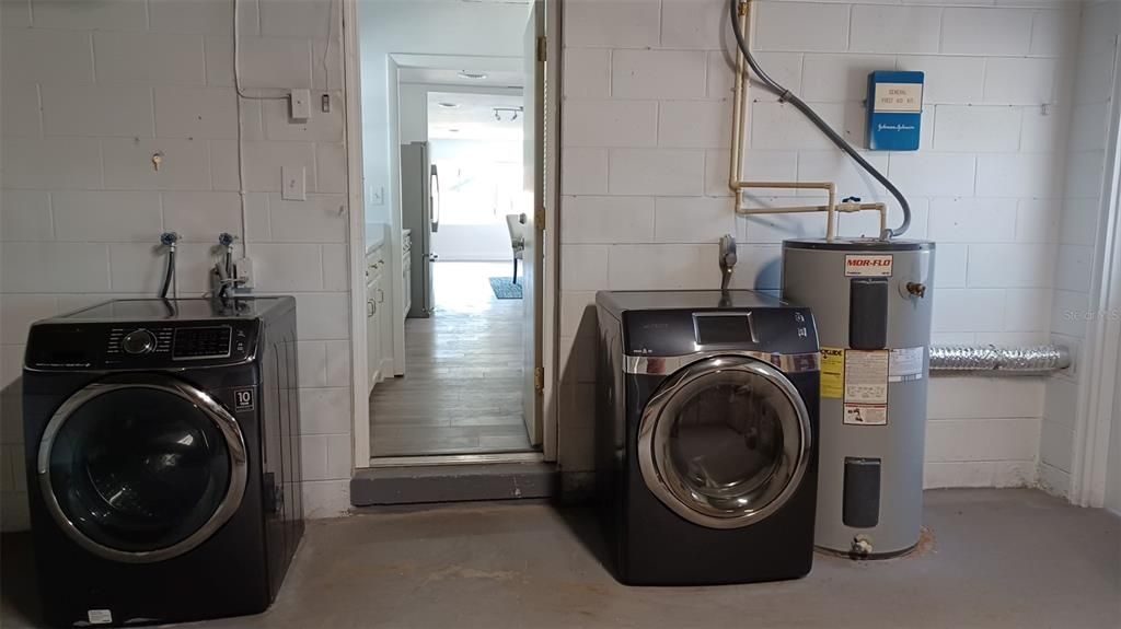 Washer, Dryer and water heater and entrance from garage to house