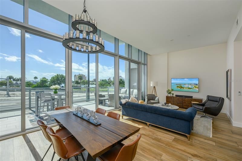 A massive great room with open sight lines showcasing the western orientation and picturesque water views