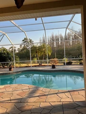 Screened pool and patio with covered sitting area for shade or beyond for fun in the sun.