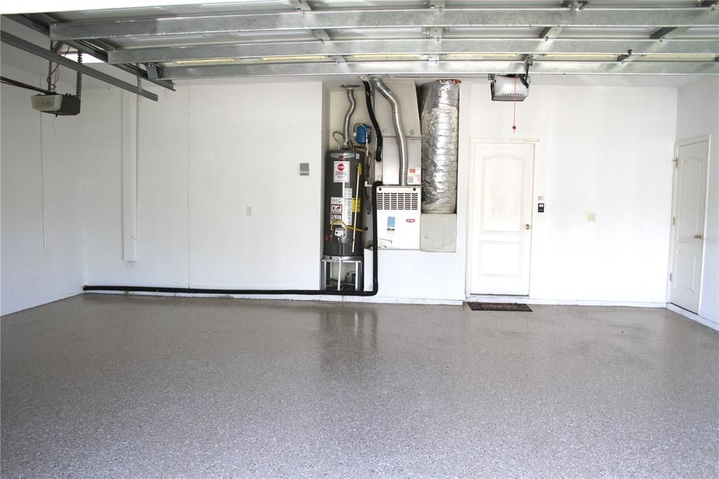 3 car garage with door opener and refinished flooring and new gas water heater.