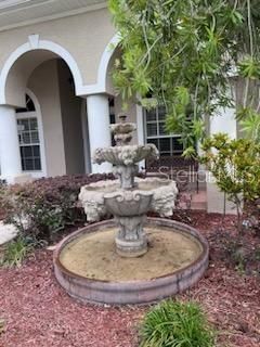Fountain in front by front patio