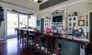 Fantastic long bar - kitchenette area behind the bar offers a wine and beer cooler.