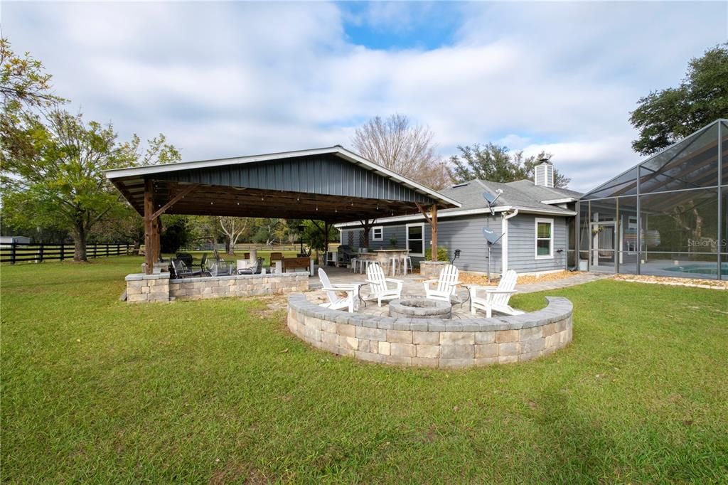 Paver fire pit and rear view of pavilion