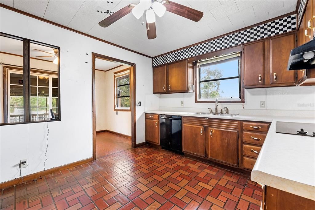 View from Kitchen that lead  ''mud'' room and outdoor patio/pool