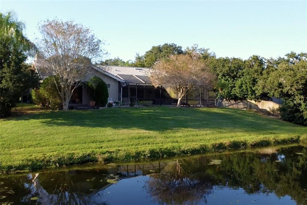 View of the house from the other side of the pond