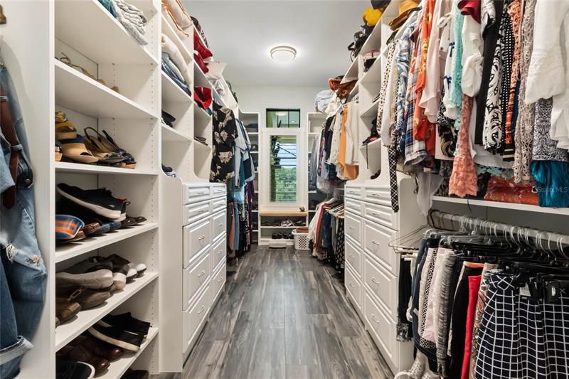 Master closet has a window for natural lighting.