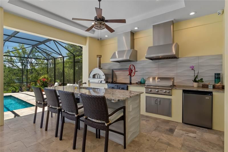 Summer kitchen with a pizza oven, among many other features.