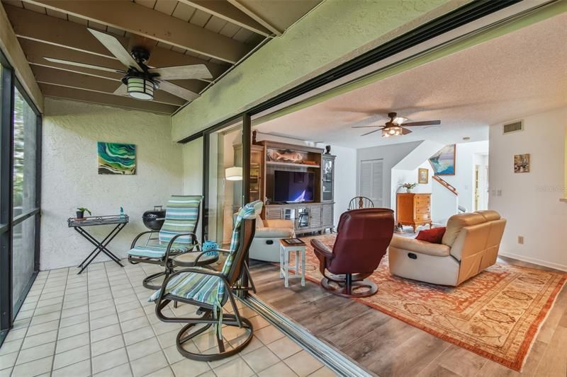 Huge Enclosed Back Porch w/tile & sliders opens to the family room & dining room
