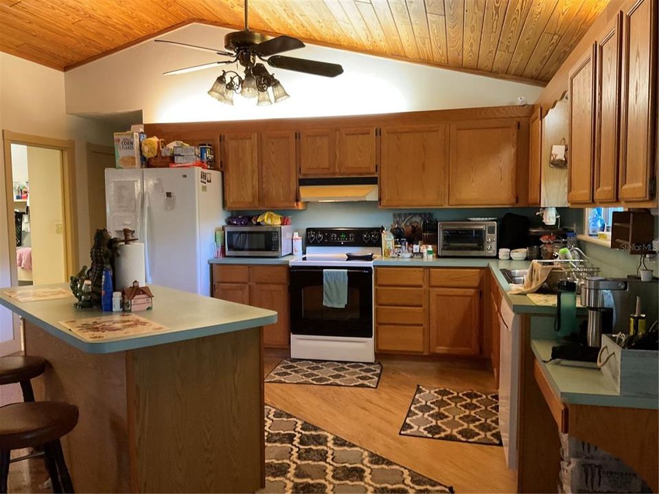 Ceiling Fan in Kitchen -High Wood Ceilings