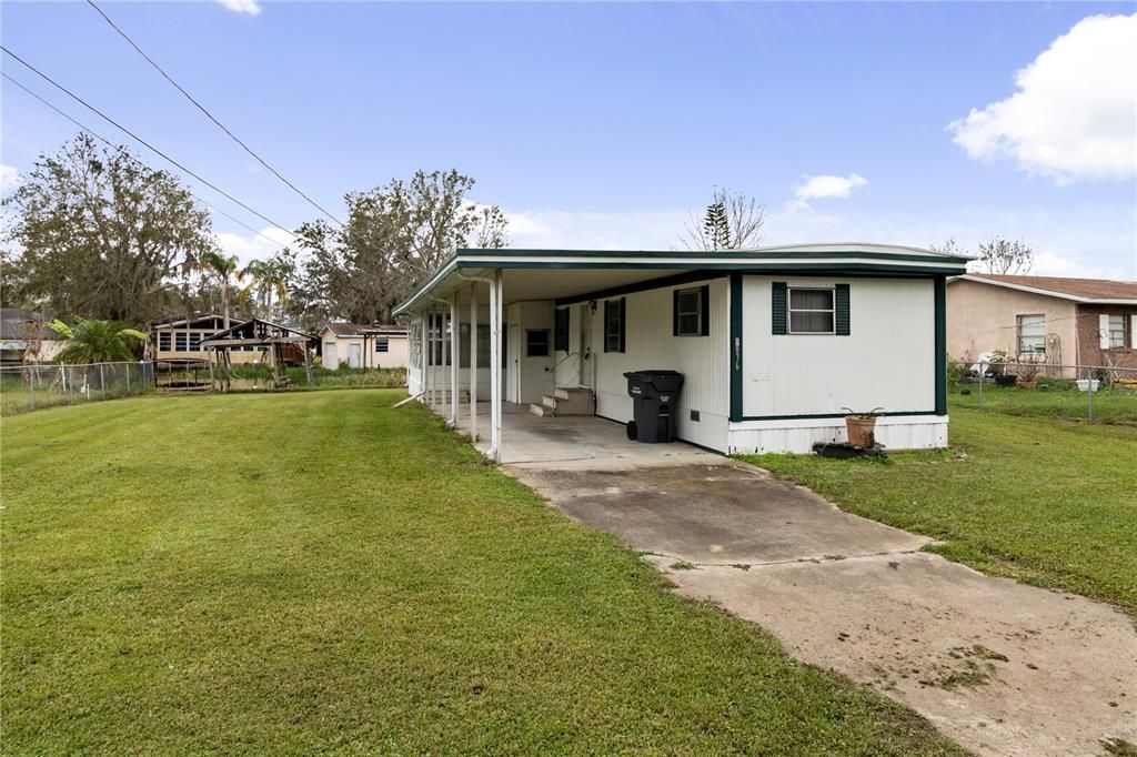 Front of property, driveway, carport