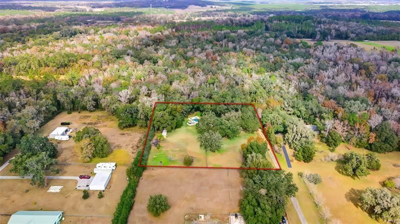 2.5 with home, pool, spa, 4 sheds and RV parking pad
