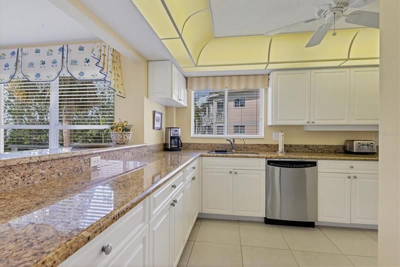 Kitchen with granite counters & stainless appliances