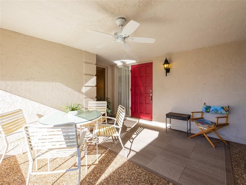 Inviting walled and screened front porch that faces to the West for your sunset views!