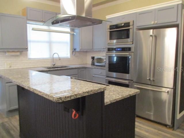 Chef's delight!  3 ovens and granite counter tops.
