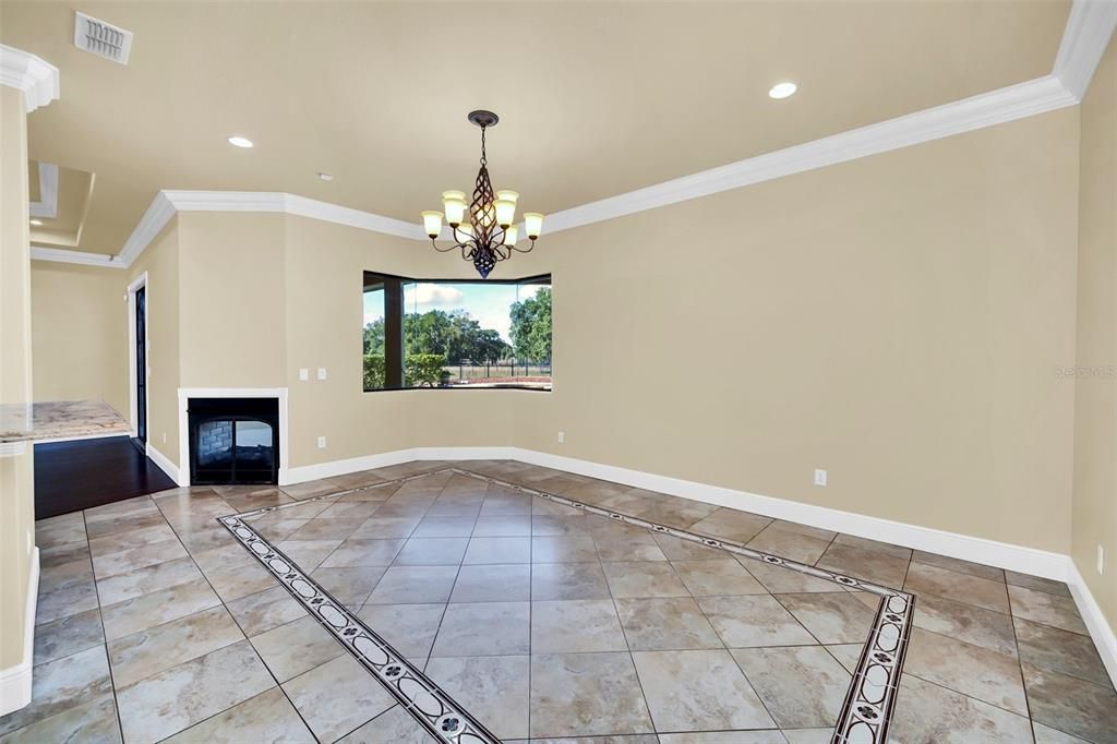 Family Room Delite! Tile floors, Double sided gas fireplace to outside lanai! Picture Window too
