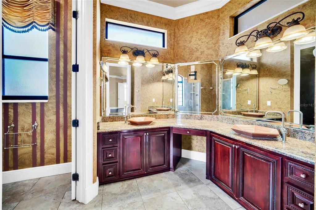 counters, full mirrors, raised bowls and custom cabinetry