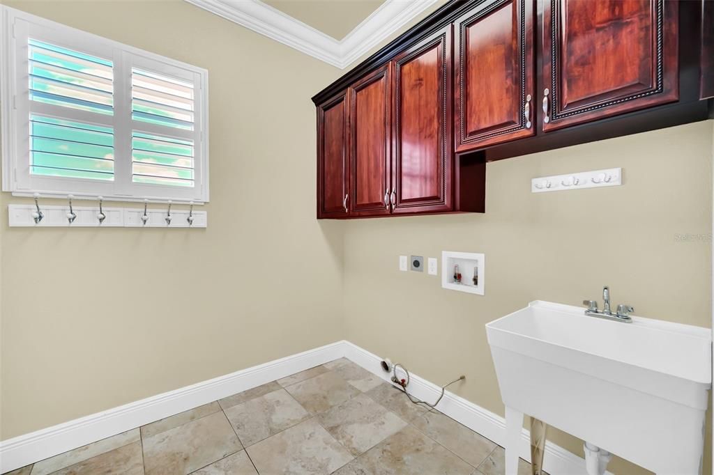 Inside Laundry Room with sink & cabinetry