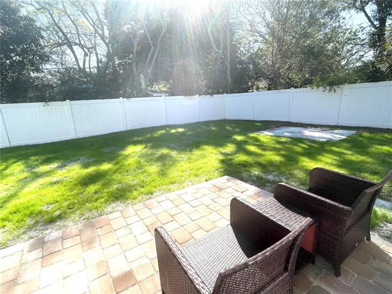You will enjoy quite time back here with the vinyl privacy fence.