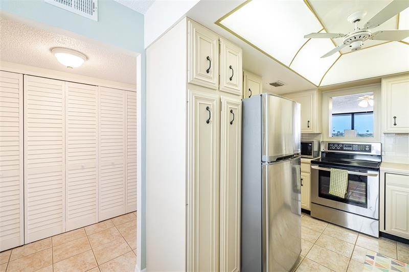 As you enter the unit the kitchen is to the right  and a large closet for storage to the left.