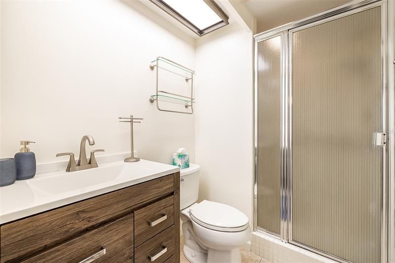 The second bathroom has a walk-in shower and will also have a mirror above the sink.