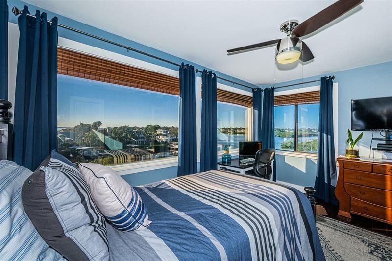 Bedroom with ceiling fan and walk-in closet. Imagine waking up to this view!