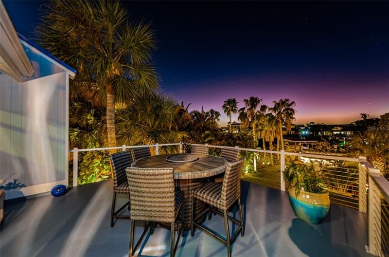 Enjoy nightly sunsets while dining on this deck, steps from the kitchen.