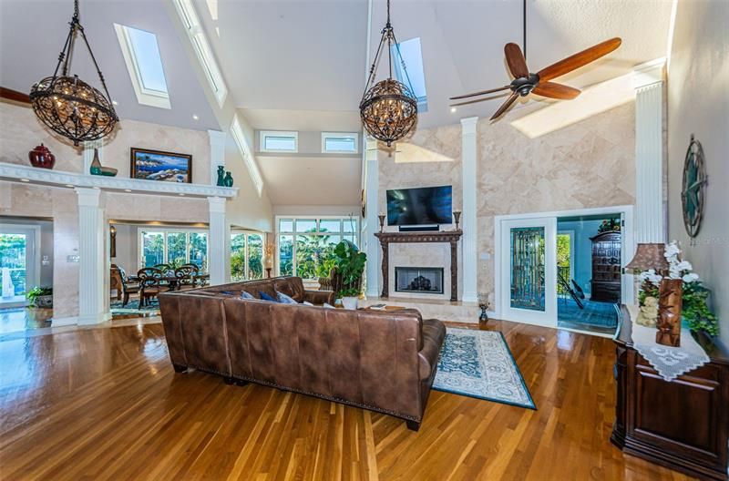 The living room with gas fireplace, soaring ceilings and spectacular views.