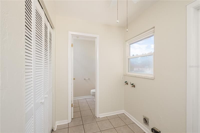 Laundry Room w/wall closet/pantry and access to pool bath