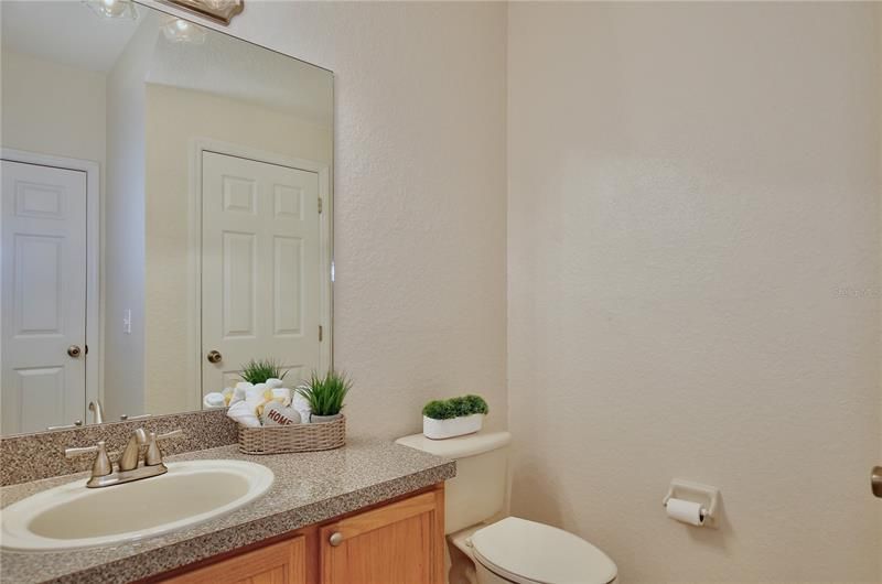 1st floor Powder Room with a large storage closet.